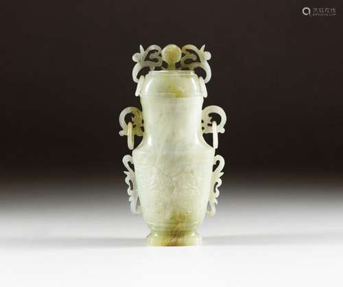 A celadon jade archaistic vase and cover, Qing dynasty, 19th...