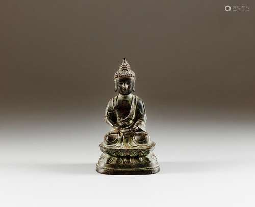 A bronze seated figure of Buddha, late Ming dynasty | 明末 銅...