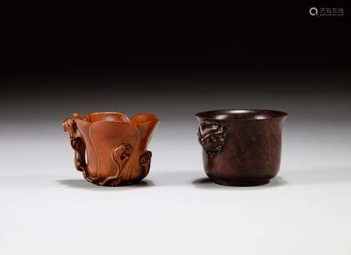 An archaistic handled 'zitan' cup and a boxwood magn...