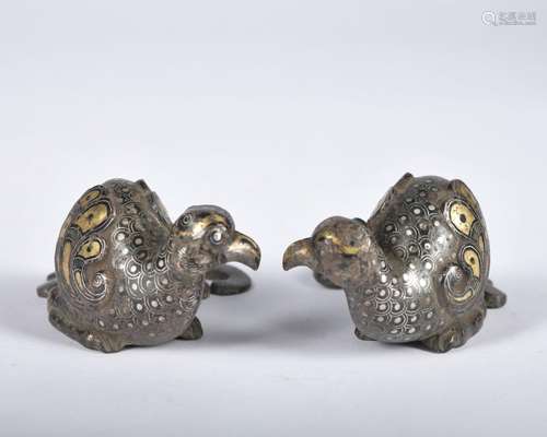 A pair of bronze bird ware with gold and silver