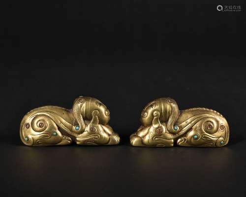 A pair of gilt-bronze figure