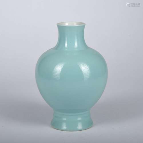 A celadon-glazed vase