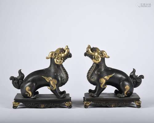 A pair of gilt-bronze beast