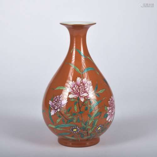 A red ground famille-rose 'floral' pear-shaped vase