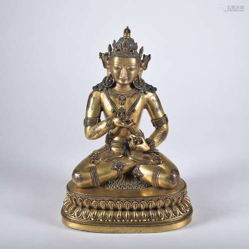 A gilt-bronze statue of Vajrapani