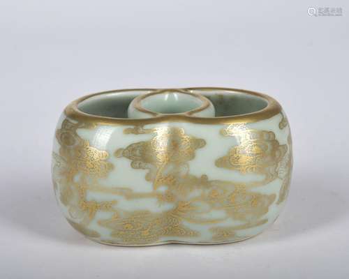 A celadon-glazed washer painting in gold