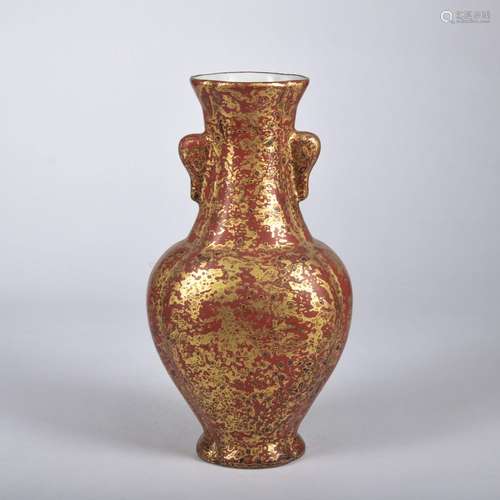 A red glazed vase painting in gold