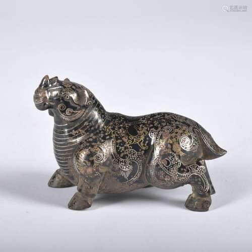 A bronze beast ware with gold and silver