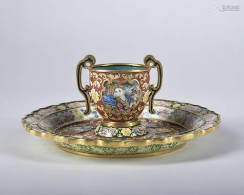 An enamel 'figure' teacup and holder