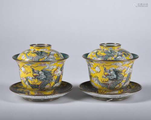 A pair of enamel 'dragon' teacup and holder