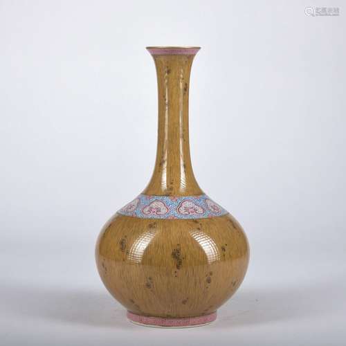 A wooden glazed vase