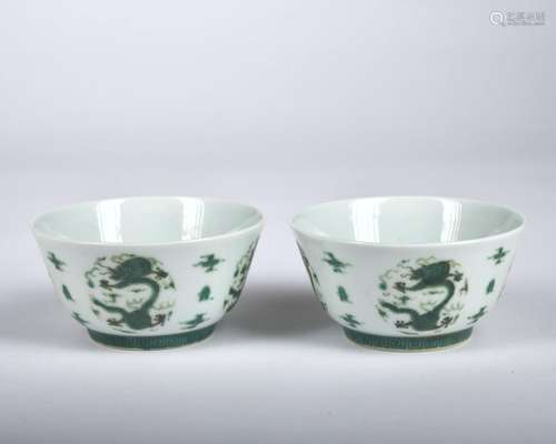 A pair of green glazed 'dragon' bowl