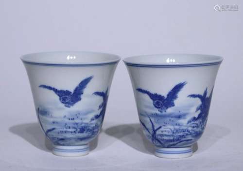 A pair of blue and white master cups