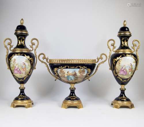 A three-part porcelain garniture with bronze mount in Sèvres...