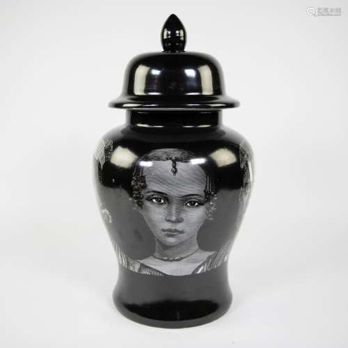 Black ceramic lided vase with contrasting print of a faces o...