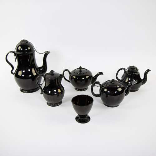 Four teapots, coffee pot and cup in black earthenware, Namur...