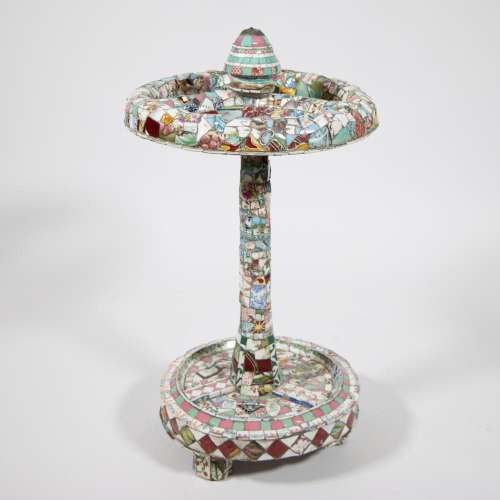 Vintage umbrella stand with colorful mosaic decorations