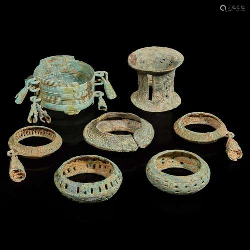 Seven assorted Vietnamese bronze bracelets and leg ornaments...