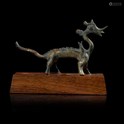 A small Chinese gilt-bronze figure of a striding dragon 铜鎏...