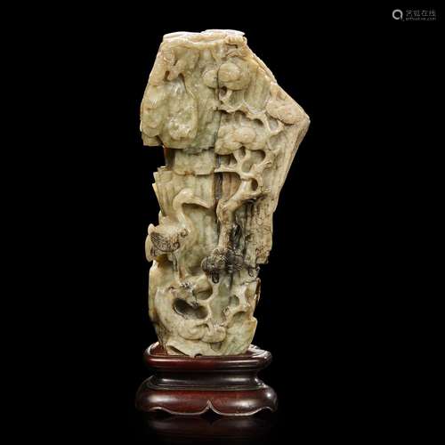 A Chinese carved grey jade "mountain" 提油灰玉山子...