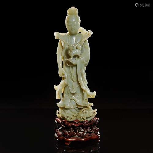 A large Chinese carved celadon jade figure of a bodhisattva ...