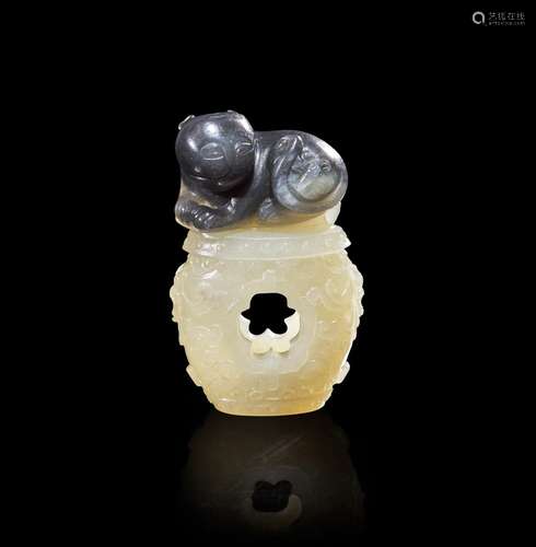 A Chinese carved two-color jade "Cat and Butterfly on G...