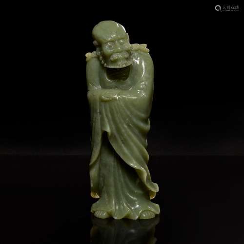 A Chinese carved celadon jade figure of a Lohan 青玉雕罗汉