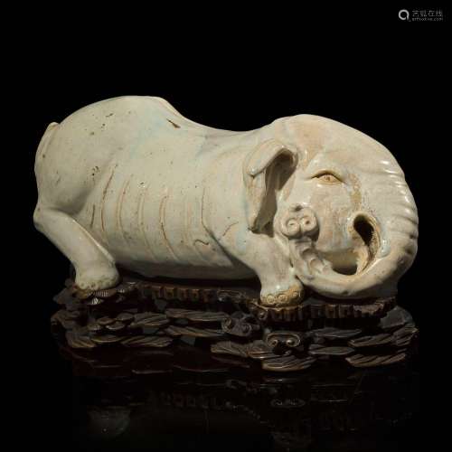 An unusual Chinese elephant-form white-glazed stoneware pill...