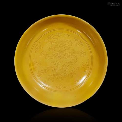 A Chinese yellow-glazed dragon dish 黄釉龙纹盘 Qianlong mark...