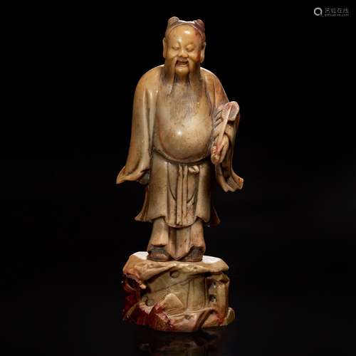 A Chinese carved beige soapstone figure of the Daoist immort...