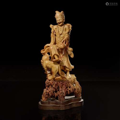 A Chinese carved beige soapstone figure of an immortal or mo...