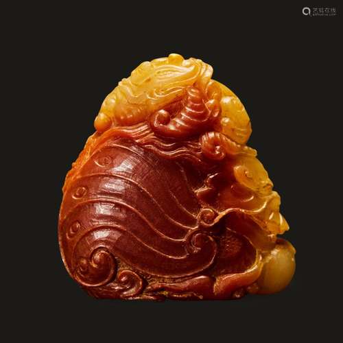 A finely-carved Chinese small yellow and russet soapstone dr...