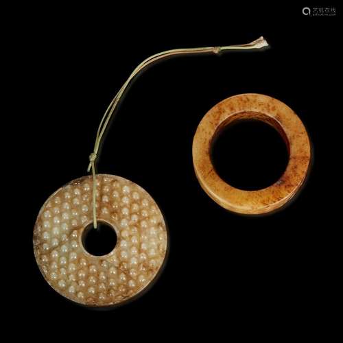 A Chinese archaistic carved beige jade bi and a large ring 古...