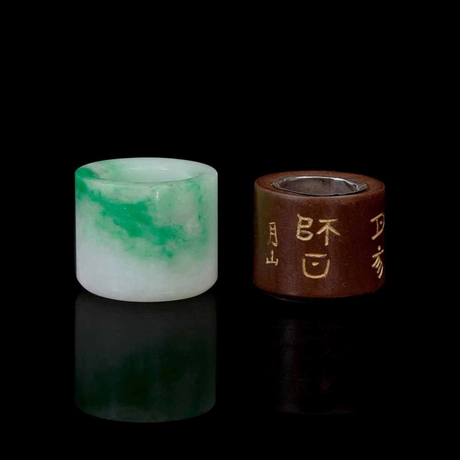 A Chinese jadeite and a wood archer's ring 翡翠及木质扳指各一