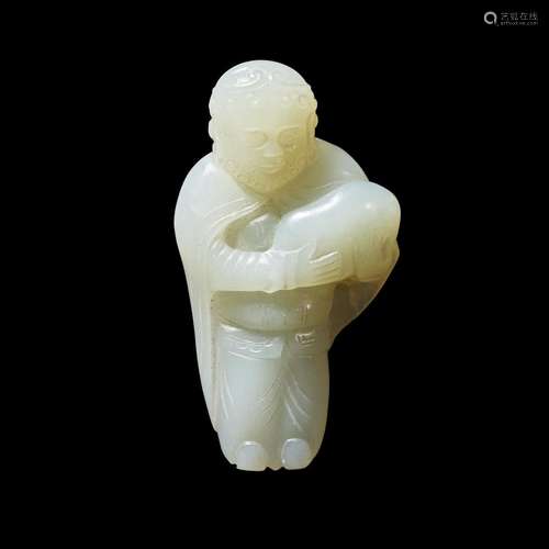 A small Chinese carved pale celadon jade figure of a foreign...