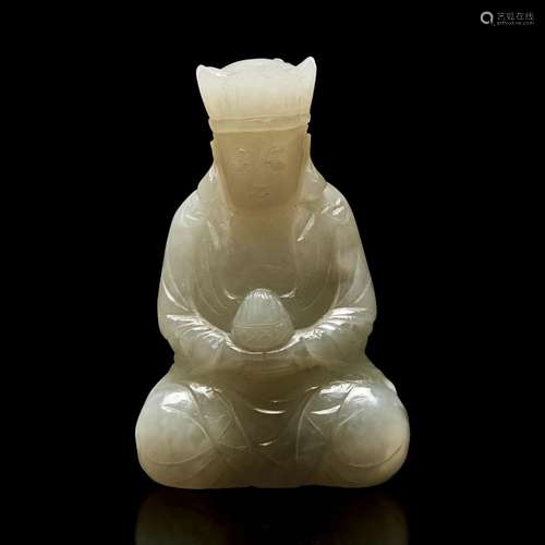 A small Chinese carved pale celadon jade figure of a crowned...