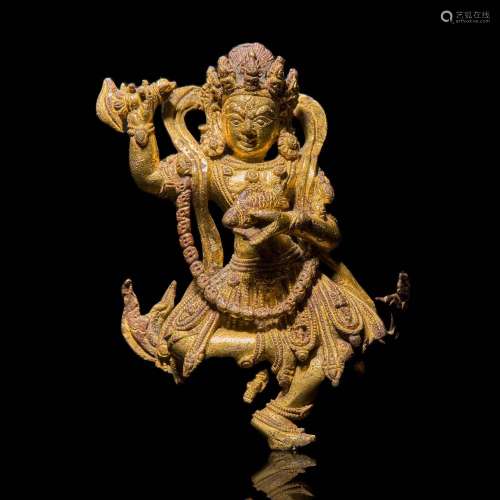 A Tibeto-Chinese or Nepalese gilt bronze figure of a wrathfu...