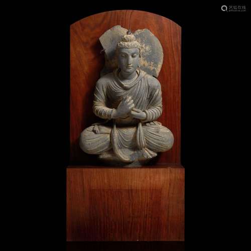 A carved schist figure of the seated Teaching Buddha 灰片岩雕...