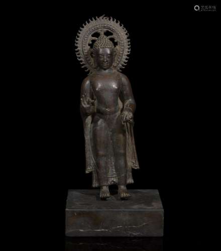 A patinated bronze figure of a standing Buddha 青铜佛造像 9t...