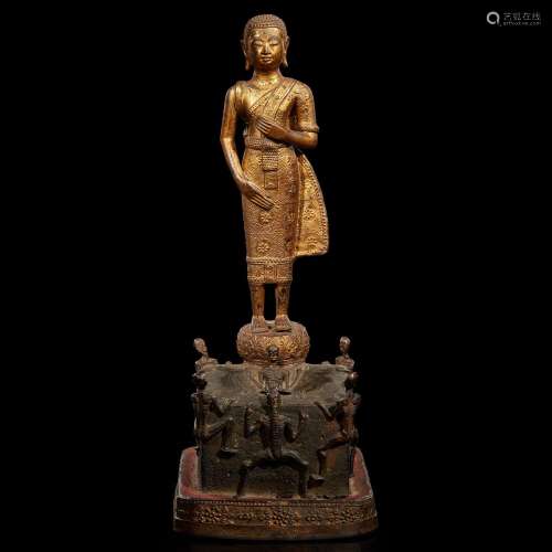 A Thai gilt-lacquered bronze figural group: Phra Malai visit...