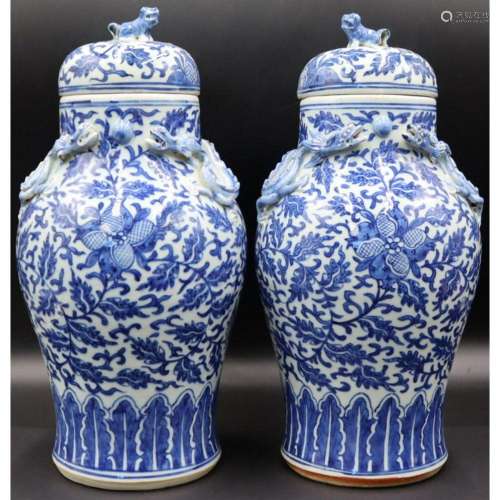 Pair of Chinese Blue and White Lidded Urns.
