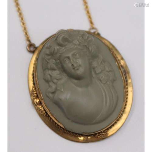 JEWELRY. 14kt Gold and Carved Lava Cameo Necklace.