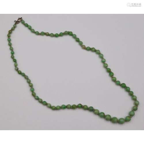 JEWELRY. 14kt Gold and Graduated Jade Necklace.