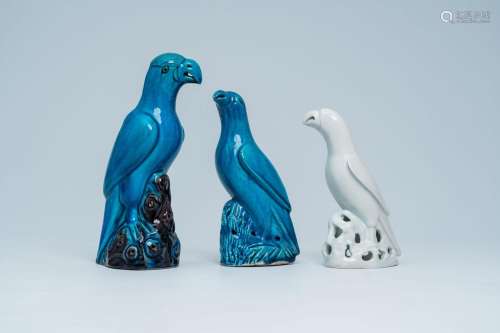 Three Chinese turquoise and white glazed models of parrots, ...