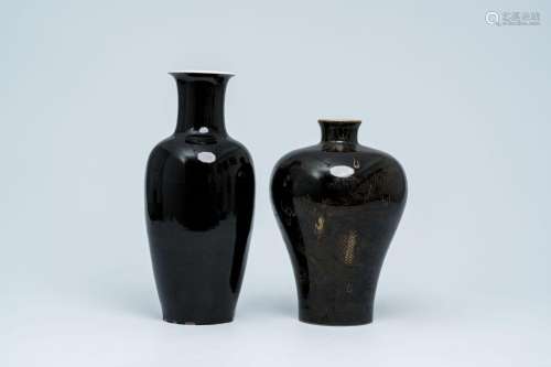 Two Chinese monochrome black-glazed vases, one with gilt dra...
