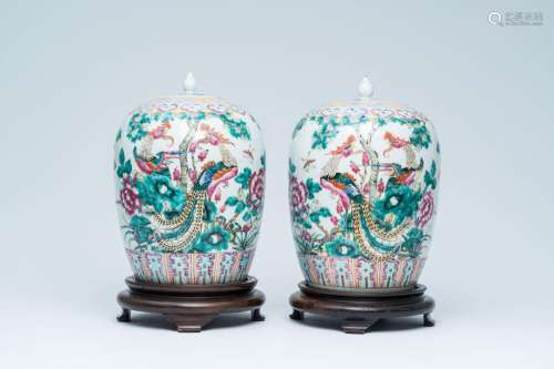 A pair of Chinese famille rose jars and covers with phoenixe...