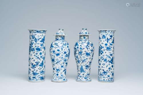 A Chinese blue and white four-piece garniture with birds and...