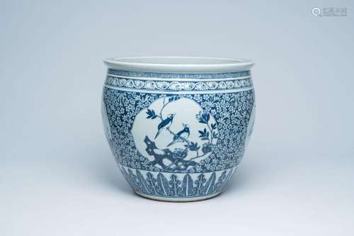 A Chinese blue and white fish bowl with bird medallions, 19t...