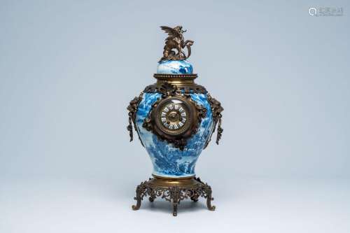A Chinese blue and white vase and cover mounted as a clock w...