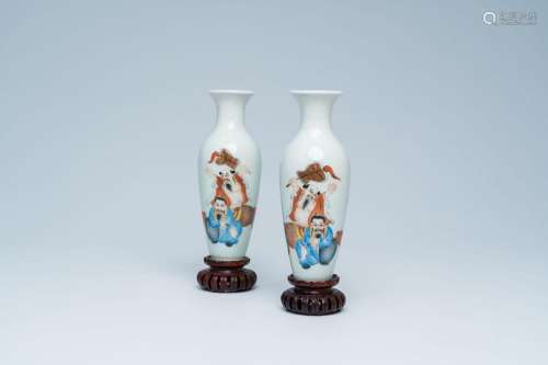 A pair of Chinese polychrome vases with a master and his ser...